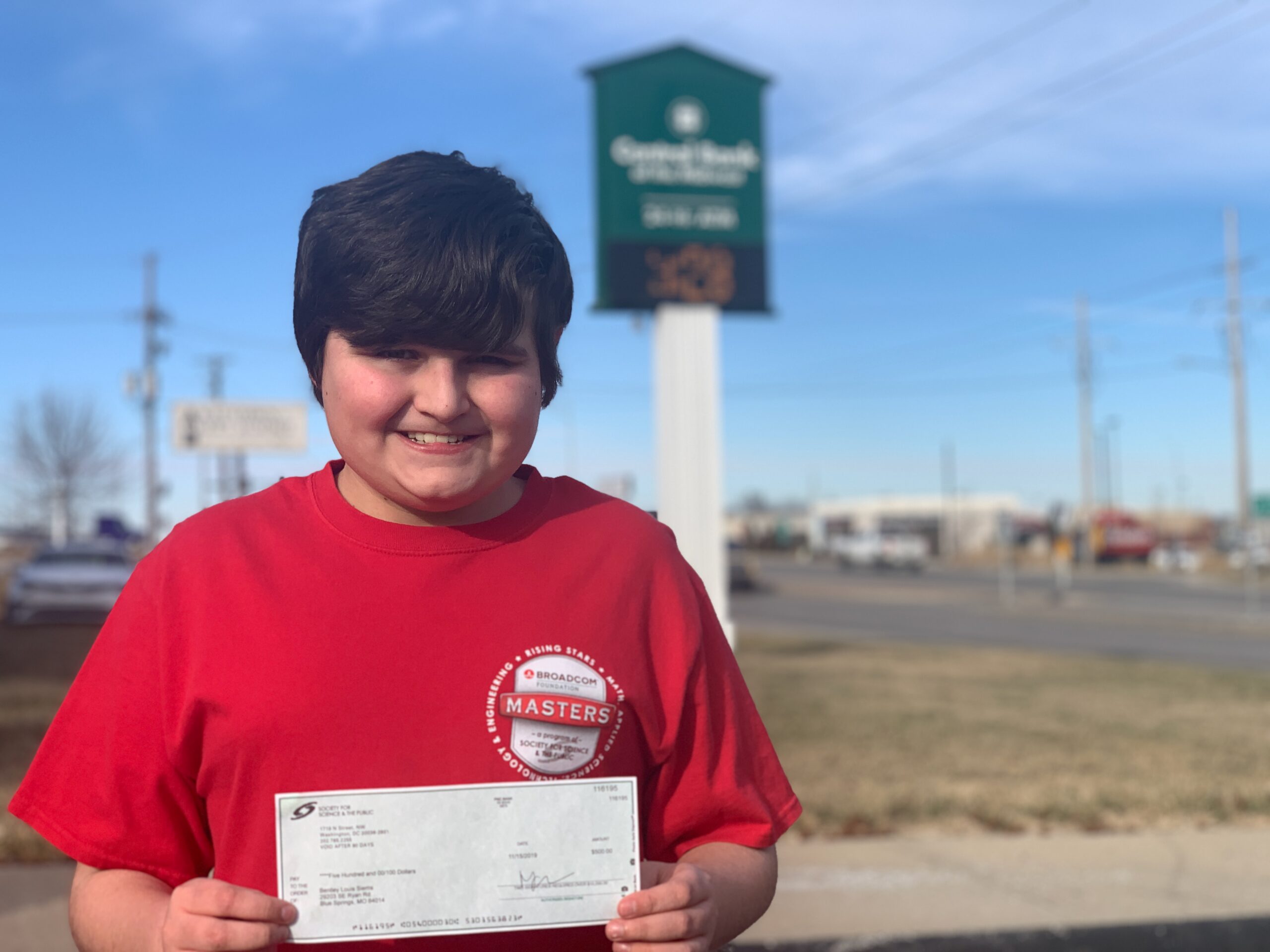 Bentley Siems holding the prize money he chose to use to start Pawportunities